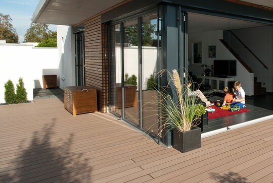 Osmo Multi-Deck solid profile boards in dark brown with a grooved surface 